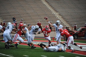 Quarterback Patrick Witt ’12 gets rid of the ball from his own end zone with the Cornell defense closing in. Witt threw for 232 yards and a touchdown.