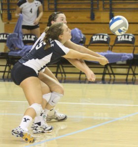 Captain and libero Kelly Ozurovich ’11, front, and outside hitter Erica Reetz ’14 go for a dig in Yale’s 3–1 win over Albany Friday.