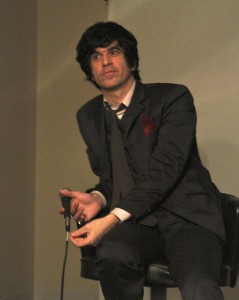 Svenonius describes his art as “post-apocalyptic.” Svenonius incorporates devices such as traditional slide projectors into his performance.
