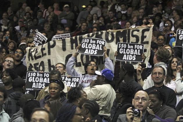 Student protesters from Yale and Harvard argue that Obama has not lived up to his campaign promise for increased funding for global AIDS relief.
