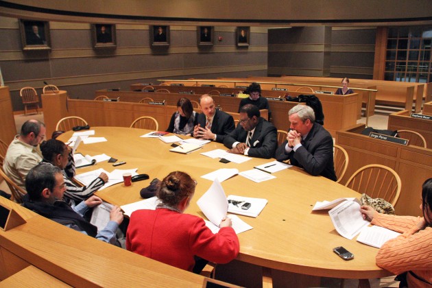 School-wide layoffs are a result of a budget gap of approximately $13 to $17 million; the city has not increased school funding for two years.