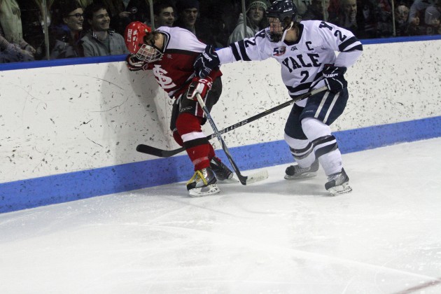 Mike Matczak ’11 applies retribution after a St. Lawrence cheap shot in the final minute of Yale’s 4–1 victory on Sat.