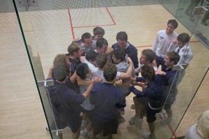 The men’s squash team swarms Naishadh Lalwani ’11 after his victory over Princeton’s Peter Sopher gave the Elis a narrow 5–4 win.