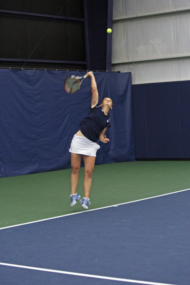 Lindsay Clark ’11, above, and Annie Sullivan ’14 clinched the doubles point against Dartmouth.