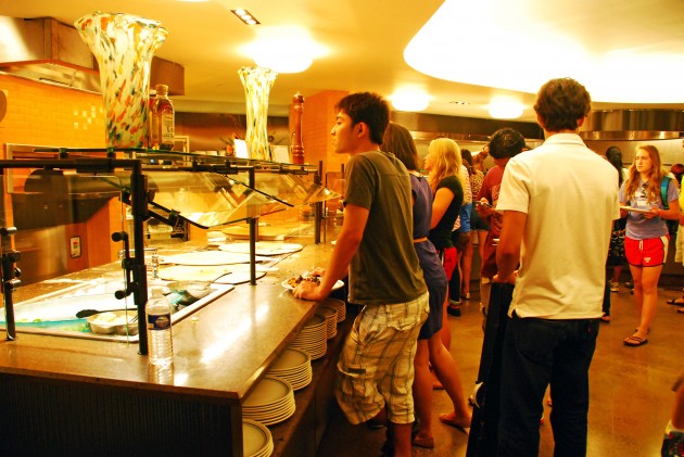 Students await a brick-oven-baked pizza in the newly renovated Ezra Stiles dining hall. The access to this dining hall will now be limited.