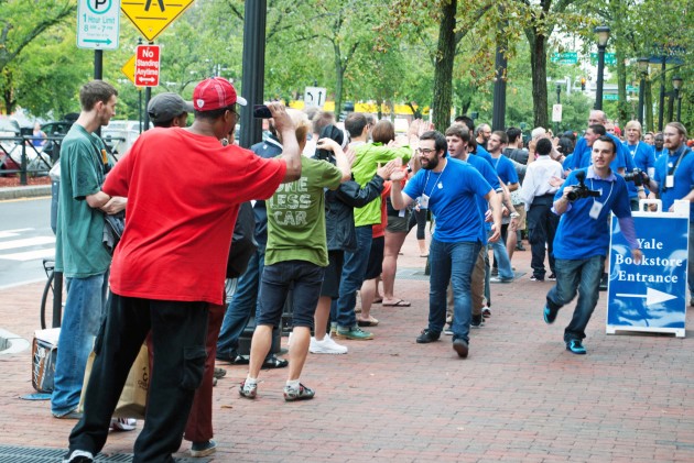 Apple employees celebrate the opening of the store on Broadway. The event drew a line that snaked around the block to Payne Whitney.