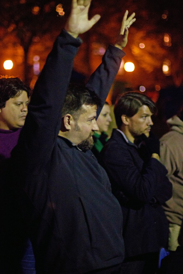 Though casual here, Reverend John Gage ’92 wore his robes for protesting.