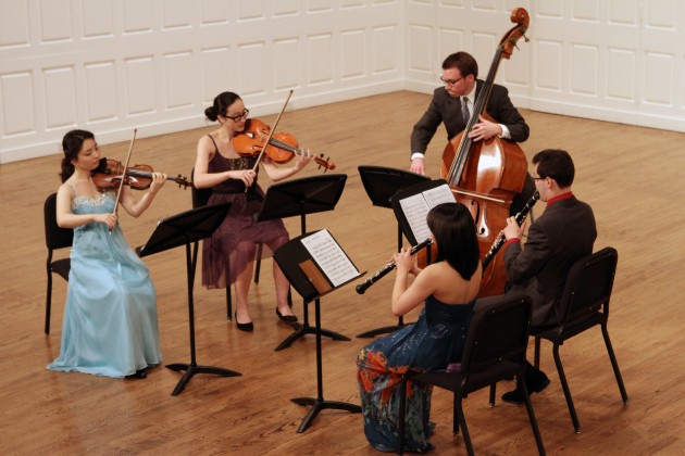 Student musicians perform classical chamber music.