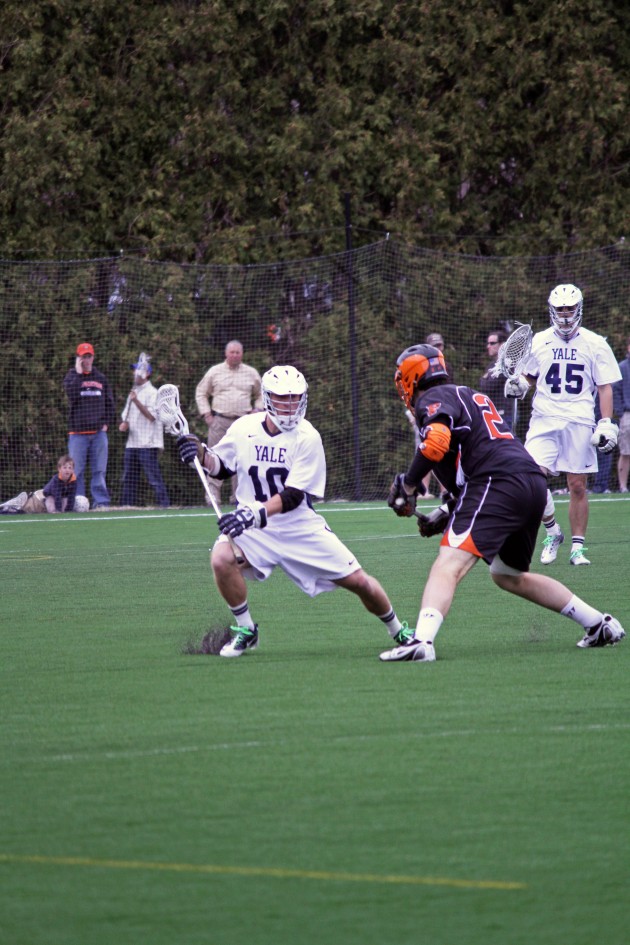 Captain Michael Pratt ’12, left, scored a late goal for the Bulldogs and then continued to play despite an injury.