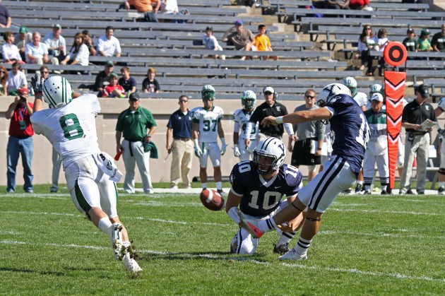 Football quarterback John Whitelaw ’14, center, announced in a Tuesday email to his teammates that he is quitting the team — the latest in a series of offseason setbacks for the Bulldogs.