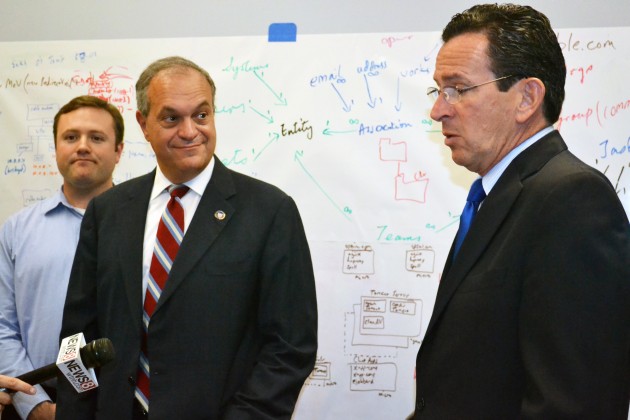 Despite efforts by Gov. Dannel Malloy, right, to eradicate the state’s fiscal woes, a new report projects a budget shortfall of $26.9 million for fiscal year 2013.