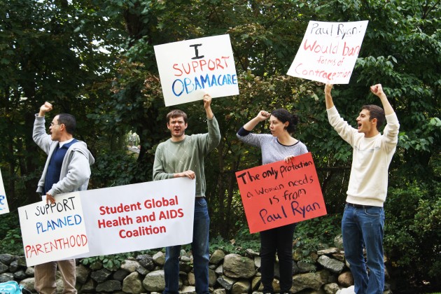 Volunteers from Yale’s Student Global Health and AIDS Coalition and New Haven Planned Parenthood protest a fundraising event for Representative Paul Ryan.