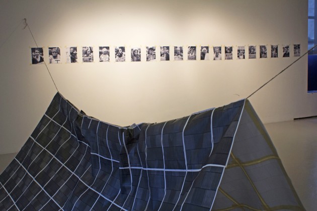 The pop-up Occupy art exhibit features a makeshift tent constructed out of printer paper.