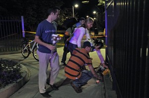 Four Yale graduate students, all of whom declined to give their names, left daisies and roses at the entrance of Amistad Park on Sunday night after the authorities announced a body had been found in 10 Amistad St.