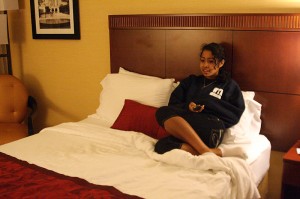Sophie Leung '11 settles in her hotel room while a cleanup crew tends to Stiles College.
