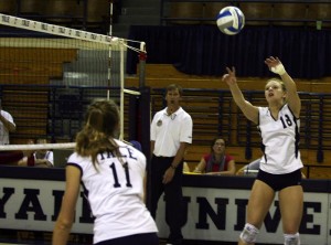 Setter Kerry Clavadetscher ’13 sets the ball to middle blocker Taylor Cramm ’12 during Yale’s three set win over Harvard on Saturday.