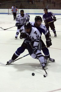 Right winger Broc Little '10 tries to get past a UOIT defender during Yale's 8-0 win in an exhibition game at Ingalls Rink on Friday.