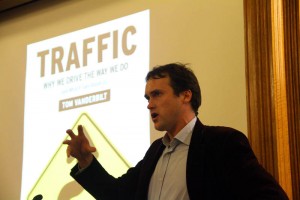 “Traffic” author Tom Vanderbilt speaks to the Sudler Hall audience Tuesday evening about the environmental costs of urban parking.