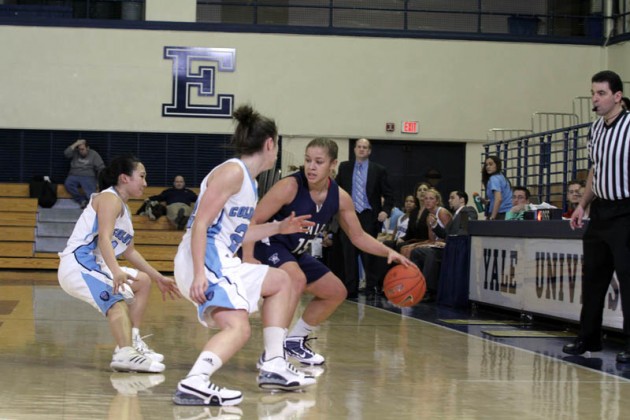 Guard Megan Vasquez ’13 looks to get past a pair of Columbia defenders Feb. 6.
