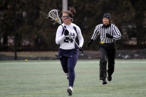 Defender Claire Eliasberg ’10 carries the ball upfield during Yale’s 14–5 loss to No. 18 Fairfield Wednesday night at Reese Stadium. The Elis are 1–1 on the season after their first ever loss to the Stags.