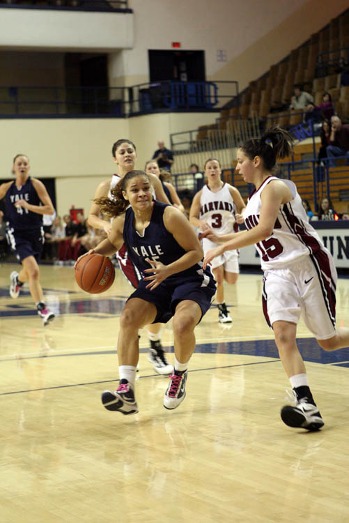 Guard Megan Vasquez ’13 dribbles past a Penn defender on Feb. 20.