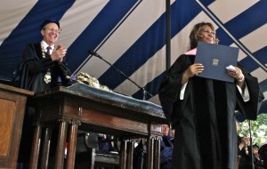 University President Richard Levin cheers for Aretha Franklin as she accepts her honorary degree.