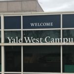 A sign saying "Yale West Campus" on a building on Yale's West Campus
