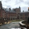 The inside of the new Humanities Quadrangle courtyard featuring a slate path and grassy section.