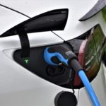 An up close of a Tesla charging