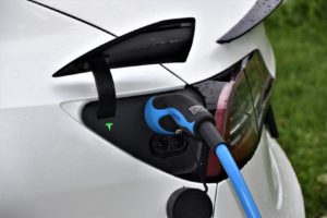 An up close of a Tesla charging
