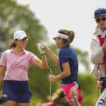 Ami Gianchandani, left, fist bumps her partner Kaitlyn Lee on the 18th hole during the first round of stroke play at the 2021 U.S. Women's Amateur Four-Ball at Maridoe Golf Club in Carrollton, Texas on Saturday, April 24, 2021.