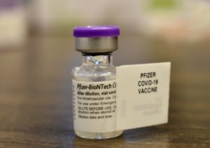 An image of a vial of a Pfizer COVID-19 vaccine.