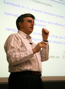Lovász gives a talk in a collared shirt.