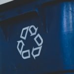 An up close of a recycling bin.