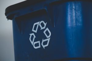 An up close of a recycling bin.