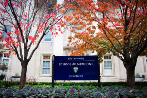 A view of the Yale School of Medicine sign in the fall.