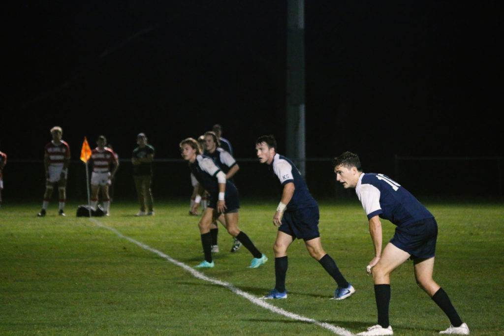 Cavan Walsh '23, Large, Nick Heymann '24, and Jackson Pullman '23 (right to left) line up prior to a kickoff.